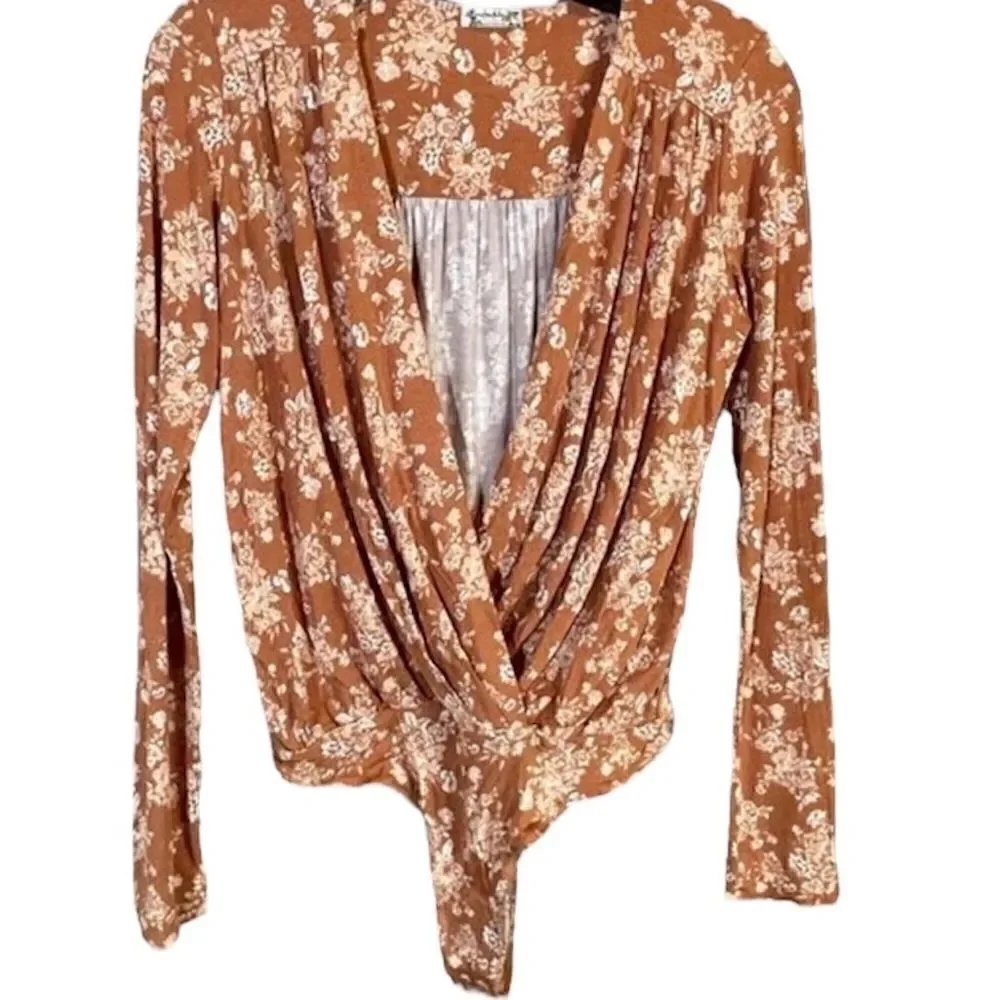 NWT-FREE PEOPLE Turnt Bodysuit